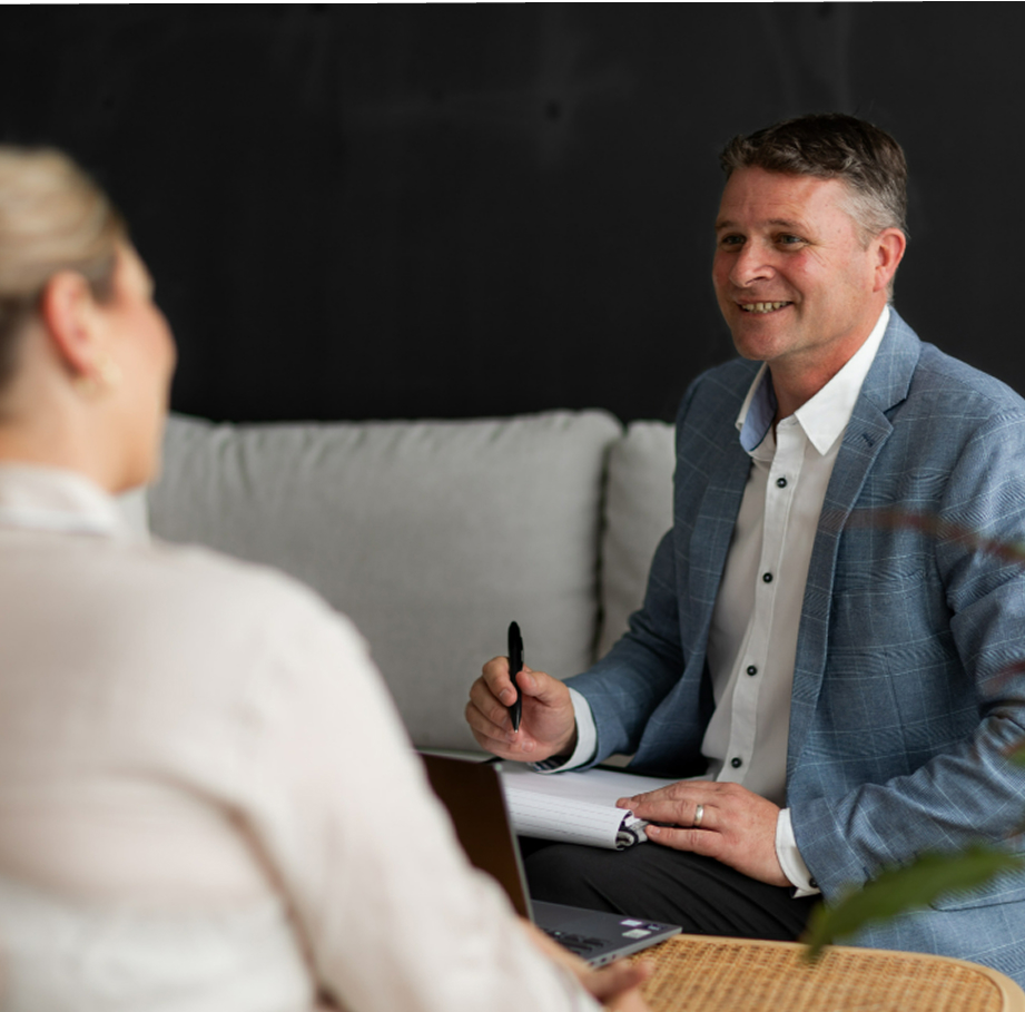 Toby Ferreira meeting with a client talking about mortgages